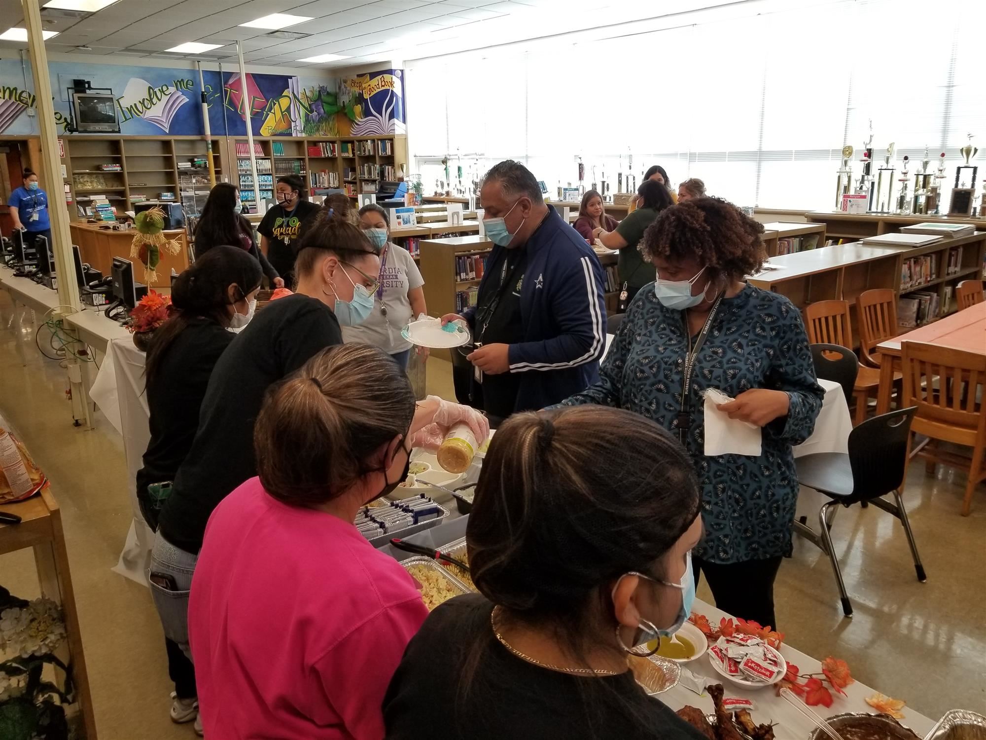 Members of staff being served
